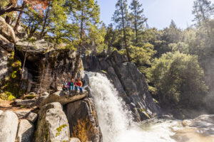 Lower Chilnualna Falls with hikers sitting nearby